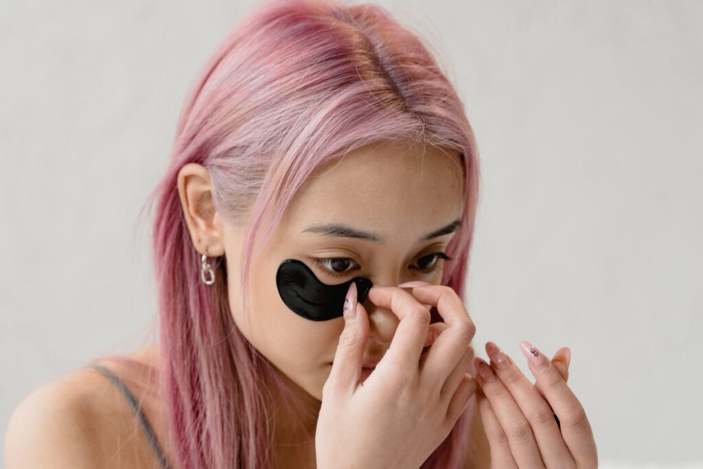 Girl with dark patches, doing skincare routine to get rid od dark circles and puffy eyes