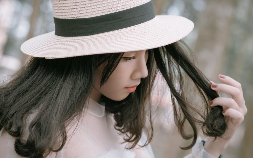 Girl with hat, wondering if hats slow down hair growth